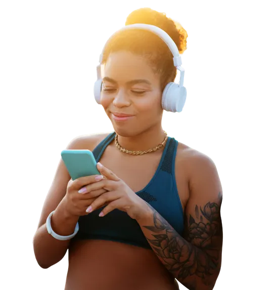 Woman wearing headphones using her phone during a workout