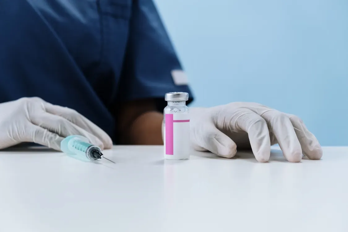 Clinician preparing a treatment for a patient